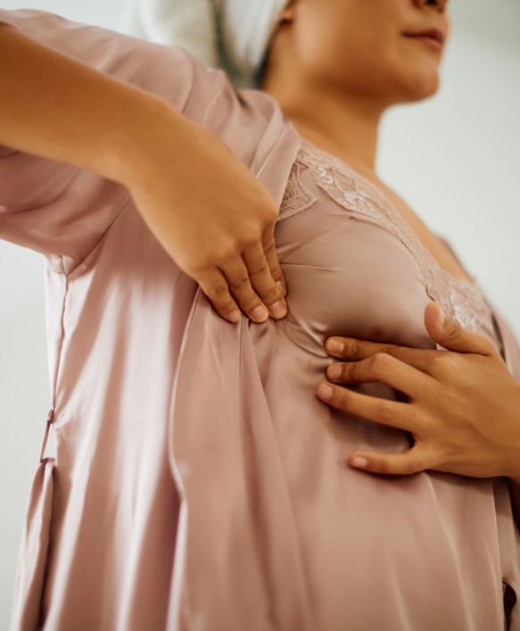 close up of woman doing breast self examination at 2024 12 13 19 51 28 utc